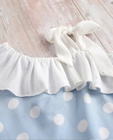 Imagen de Blusa niña hortensia de lunares asimétrica con volante