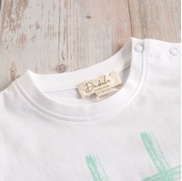 Imagen de Camiseta bebé algodón blanca estampado huellas perros