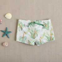 Imagen de Bañador bóxer de bebé niño en color verde con estampado y cordón elástico de color verde 