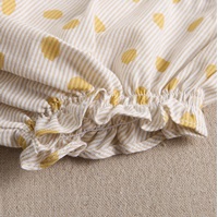 Imagen de Vestido con cubrepañal de bebé niña con estampado de lunares en tonos amarillos