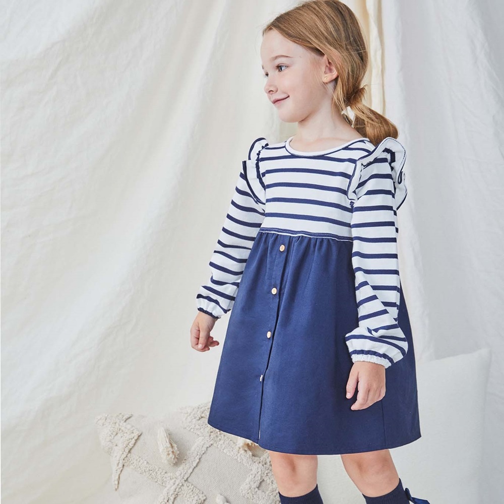 Imagen de Vestido de niña combinado con rayas marineras y tejido marino con lazo en la espalda