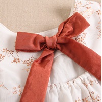 Imagen de Vestido de ceremonia para bebé niña en gasa con estampado en color cobre