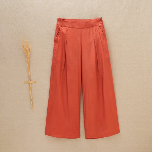 Imagen de Pantalón de niña largo en satén en color cobre rojizo