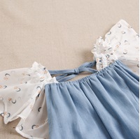 Imagen de Vestido de niña en lino azul combinado con gasa estampada