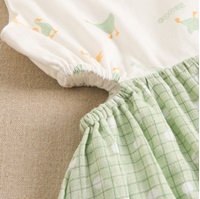 Imagen de Vestido de niña combinado con estampado de cuadros verdes y estampado de patitos