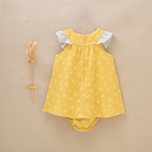 Imagen de Vestido de bebé niña amarillo mostaza con estampado de soles