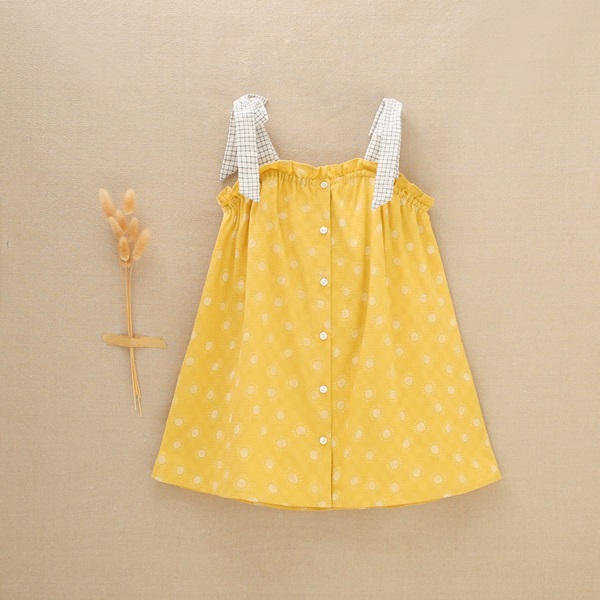 Imagen de Vestido de niña amarillo mostaza con estampado de soles