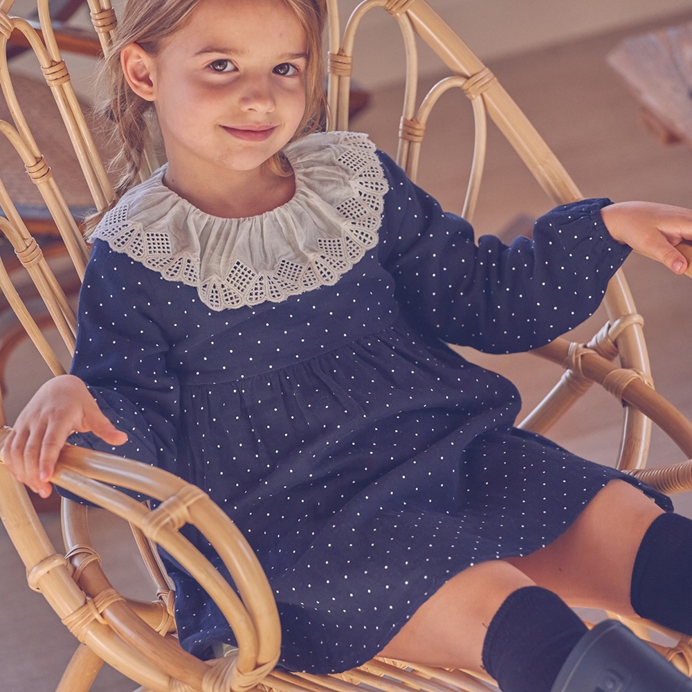 Imagen de Vestido de niña azul marino con topos blancos 