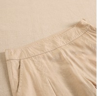 Imagen de Pantalón de niña largo, en satén, color beige-dorado