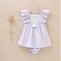 Imagen de Vestido de bebé niña en lila con bordados blancos