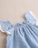 Imagen de Vestido de bebé de plumeti azul con topos blancos