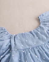 Imagen de Vestido de niña plumeti azul con topos blancos