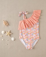 Imagen de Bañador de niña con estampado floral y volante vichy naranja