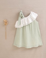 Imagen de Vestido de niña verde pastel con volante asimétrico y lazo