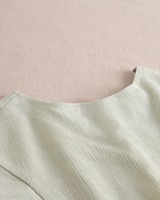 Imagen de Blusa de niña verde pastel con espalda cruzada abierta